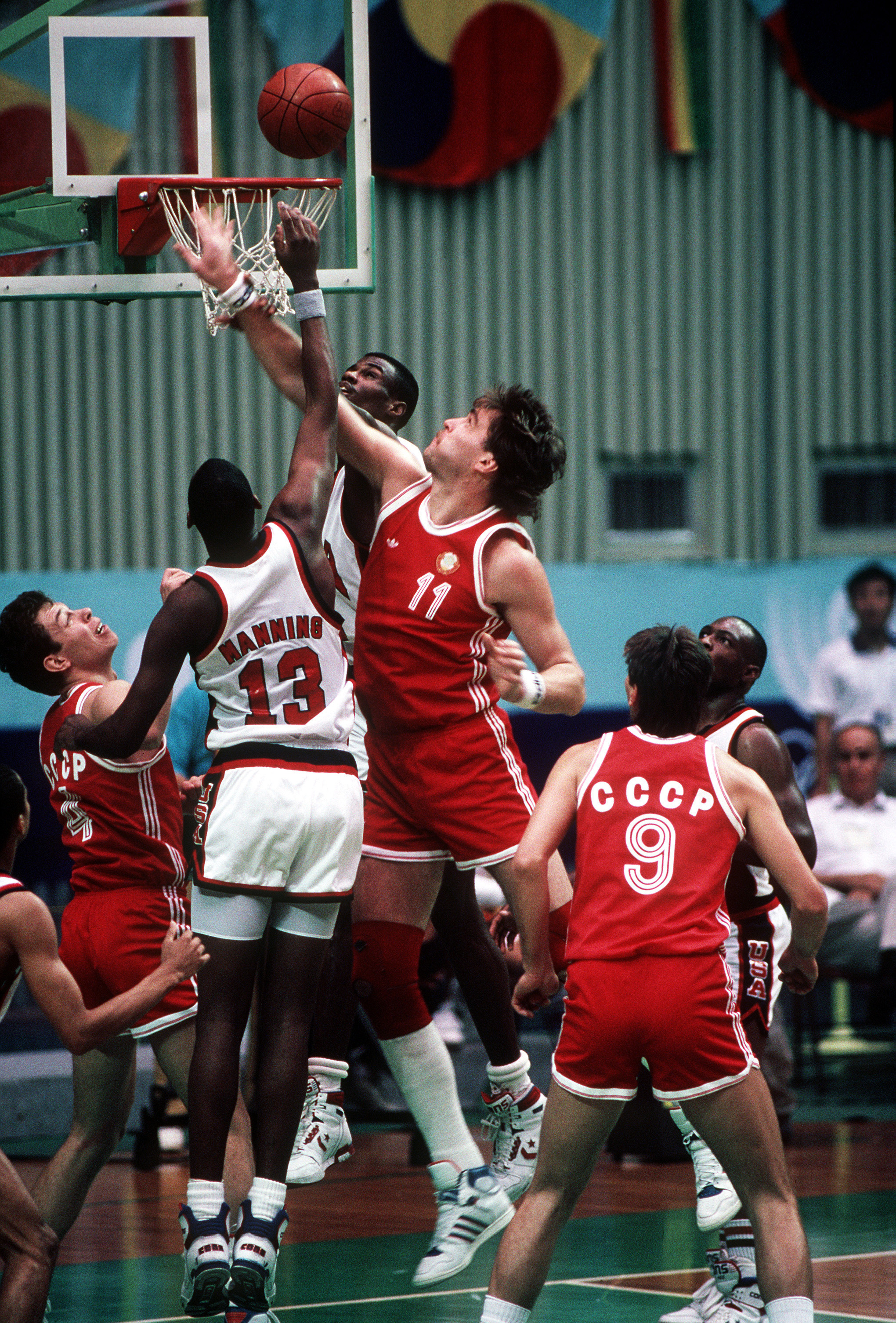 Danny Manning and the Navy's David Robinson battle a Soviet player for a rebound during the Soviet upset over the US basketball team at the XXIVth Olympiad.